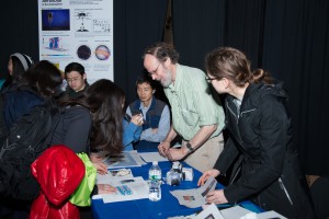 EAPS Professor of oceanography Glenn R. Flierl and Open House guests form Aerocene-like balloons to understand the physics involved in flight. (Image: Vicki S McKenna)