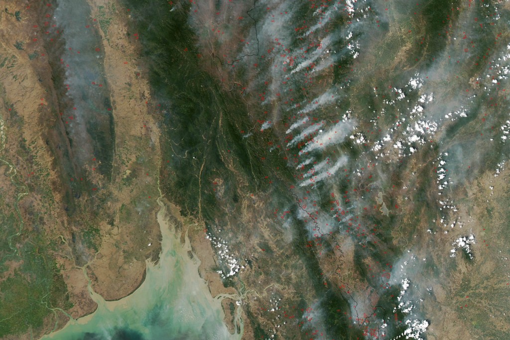 This image of fires burning throughout Burma (Myanmar) and Thailand was acquired on March 22, 2013, by the Moderate Resolution Imaging Spectroradiometer (MODIS) on NASA’s Aqua satellite. MODIS detects fires not from visible smoke plumes, but from thermal infrared energy radiating from the land surface. The heat is invisible in images like this, but the locations where MODIS detected fires are labeled with red dots. (Source: NASA)